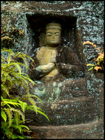 Buddha outside cave